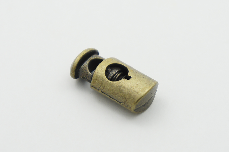 Фіксатор для шнура металевий, 12 x 25 мм Mertbutton, стара латунь, MTL 131-bronz