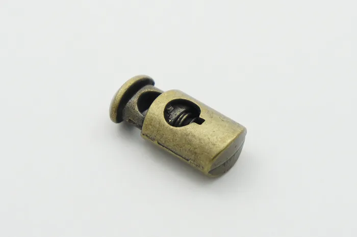 Фіксатор для шнура металевий, 12 x 25 мм Mertbutton, стара латунь, MTL 131-bronz