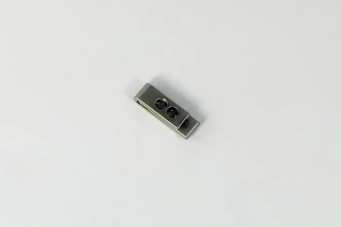 Фіксатор для шнура СТ037 металевий, 12,2 x 7,4 x 5,5 MH, нікель матовий, 6660-0145-m.nik
